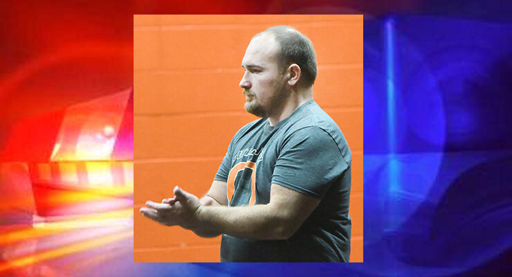 Justin H.F. Lowe is pictured during a November 2022 wrestling practice at Owensville High School where he was an assistant coach.